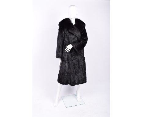 Musquash dyed black fur coat with dyed black fox fur collar , two hidden clip fastenings to front, velvet lined pockets eithe