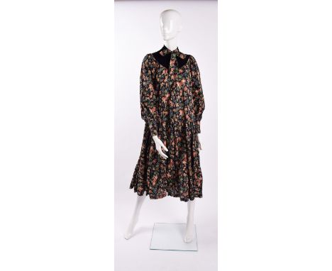 A vintage Jeff Banks floral smock dress , navy with red, cream and green toned floral decoration, black velvet high-neck coll