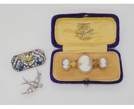THREE JEWELS a 15ct gold mounted triple cameo brooch with filigree and granulation details, largest cameo approx 2cm x 1.5cm,