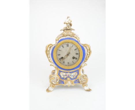 A FRENCH PORCELAIN ROCOCO STYLE CHIMING CLOCK the silvered dial with Roman numerals, within a gilt metal ring, marked to fron
