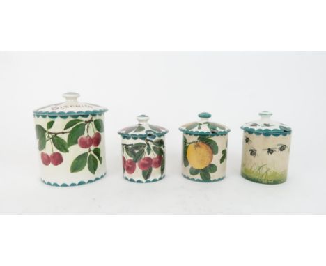 A WEMYSS BISCUIT JAR AND COVER painted with cherries, a Cherry preserve pot, a orange painted marmalade pot and a honey pot p