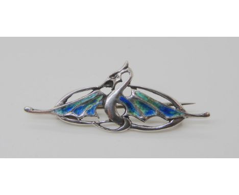 A SILVER & ENAMEL CYMRIC BROOCH featuring a dragon, stamped Cymric Sterling to the reverse. Dimensions 5.2cm x 2cm, weight 5.