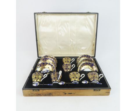 AN AYNSLEY BOXED SET OF COFFEE CUPS AND SAUCERS with cobalt blue and gilt decoration,&nbsp;pattern no 869, together with six 