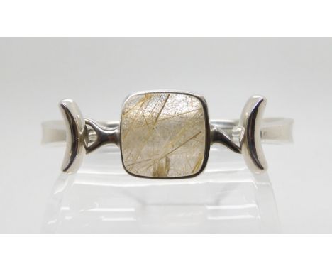 A SILVER GEORG JENSEN BANGLE designed in the 1960's, by Vivianna Torun Bulow Hube for Georg Jensen, bangle pattern number 207