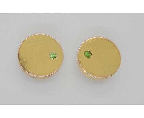 A PAIR OF RUSSIAN SHIRT STUDS both set with demantoid green garnets to the front, the stud backs are stamped 56 (for 56 zolni