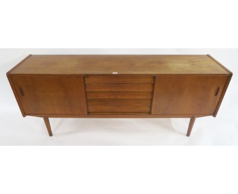 A MID 20TH CENTURY SWEDISH TEAK NILS JONSSON FOR TROEDS "TRIO" SIDEBOARD with central bank of drawers flanked by sliding door