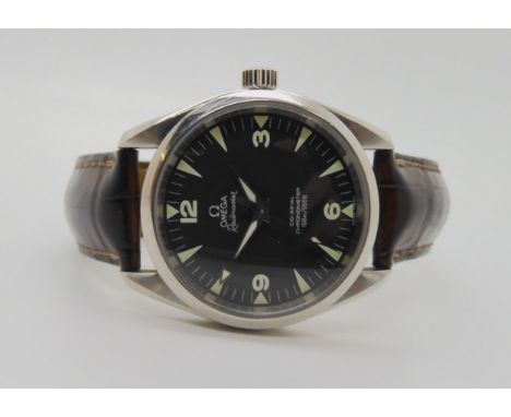 AN OMEGA RAILMASTER CO AXIAL GENTS WRISTWATCH with black dial, luminous chevron and Arabic numerals, and arrow shaped hands. 