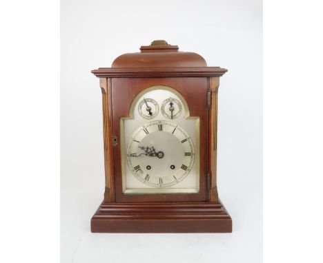 A LATE 19TH CENTURY CHIMING MANTLE CLOCK the arched silvered dial with silvered chapter ring and Roman numerals, with two sub