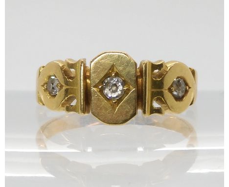 A VICTORIAN DIAMOND SET RING set with three old cut diamonds, with an estimated approx diamond content of 0.12cts, with parti