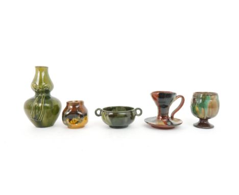 A COLLECTION OF DUNMORE POTTERY to include a green glazed two handled bowl, a dimpled pot in shades of brown, green and musta