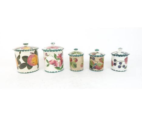 A WEMYSS SWEET PEA DECORATED BISCUIT JAR AND COVER a further jar and cover painted with apples, two bramble decorated preserv