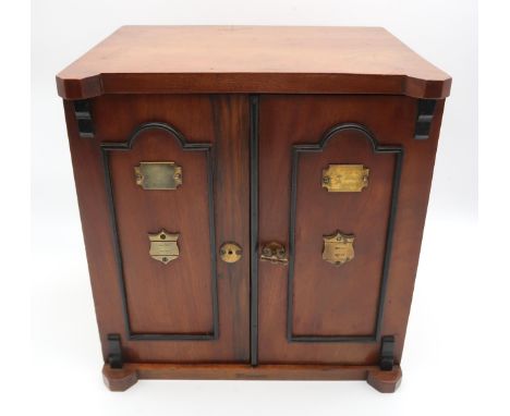 A LATE VICTORIAN OAK SMOKERS CABINET IN THE FORM OF A TWO DOOR SAFE, with ebonised beaded doors concealing three drawers, sli