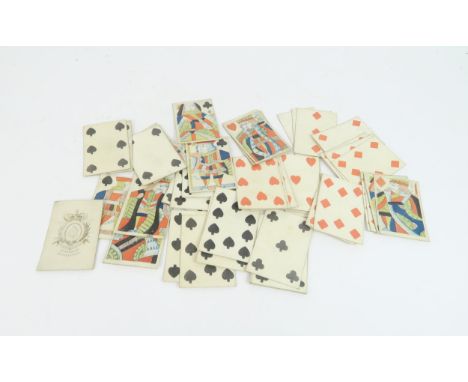 T WHEELER EXPORATION GIII PLAYING CARDS within a straw covered box and decorated with a frigate, 10.5cm x 7.5cm and 4cm high 
