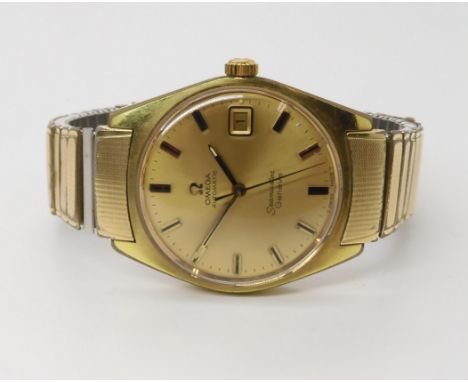 A GOLD PLATED OMEGA SEAMASTER GENEVE with gold coloured dial, baton numerals and hands and date aperture. diameter of the cas