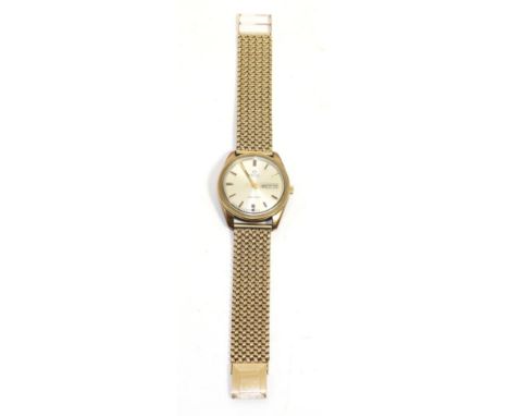 A 9ct gold automatic day/date centre seconds wristwatch, signed Omega, model: Seamaster, circa 1970, lever movement, silvered