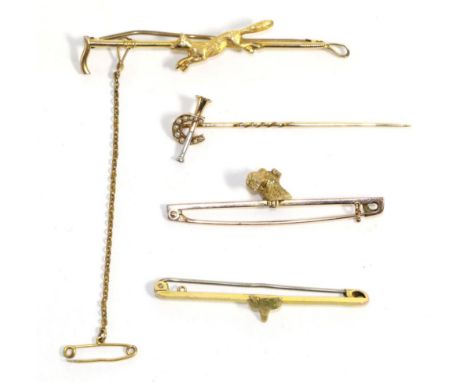 A Terrier dog bar brooch, a realistically modelled head of a dog to a flat bar, measures 5cm long, a 9 carat gold fox and cro