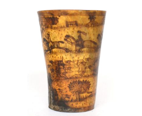 A horn beaker, 19th century, decorated with a hunting scene, 14.5cm high 