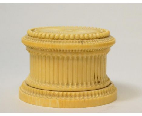 An ivory box and cover, early 19th century, of circular form with engine turned decoration, 9cm diameter