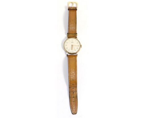 < A 9ct gold wristwatch, signed Smiths, model: Deluxe, 1955, lever movement, silvered dial with Arabic numerals, seconds dial