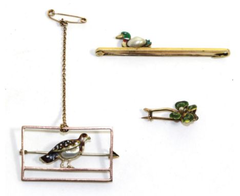 An enamel and pearl partridge brooch, realistically modelled with a blister pearl body to a rectangular frame, measures 2cm b