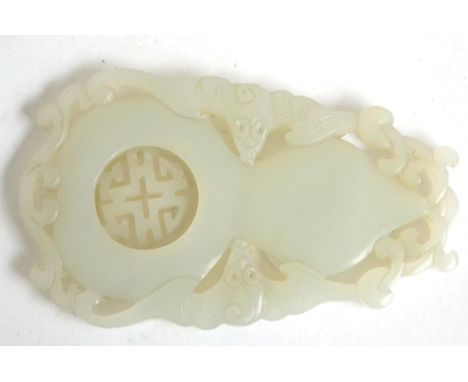 A Chinese jade plaque carved with an articulated Shou character in a flattened gourd flanked by two bats, 8cm long 