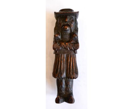 < A treen figural nut cracker, 19th century, as a gentleman in 17th century costume, 18.5cm high
