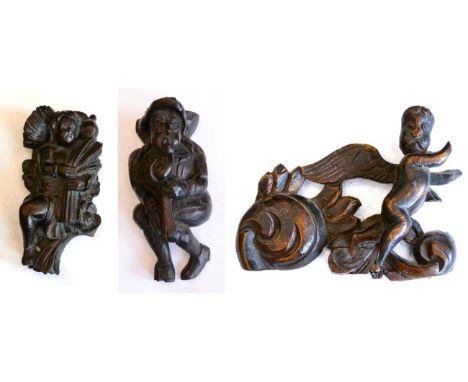 < A carved oak figure of a musician, 16th century, playing a serpent, 18cm; a carved oak figure representing Autumn carrying 