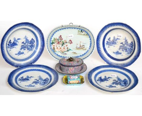 ^ A Chinese porcelain oval dish Qianlong, painted with famille rose enamels with junks mooring beside a castle, within a pier