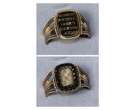 A Victorian mourning ring, a reversilbe oblong plaque in black enamel picked out to read 'ROBERT SWAINE OB: 23 DEC: 1812 AET: