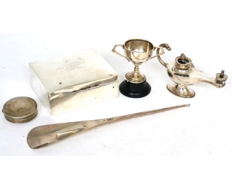 A group of silver items, comprising: an Asprey silver shoe horn, London 1913; an Asprey table lighter, marks indistinct inscr