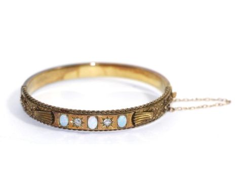 An opal and diamond bangle, the front with three oval opals spaced by two old cut diamonds in star settings, with cannetille 