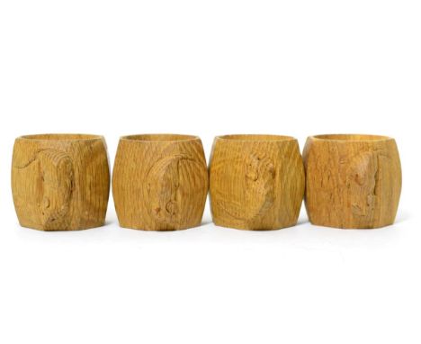 Four Robert ''Mouseman'' Thompson oak napkin rings, each with carved mouse signature, 5cm