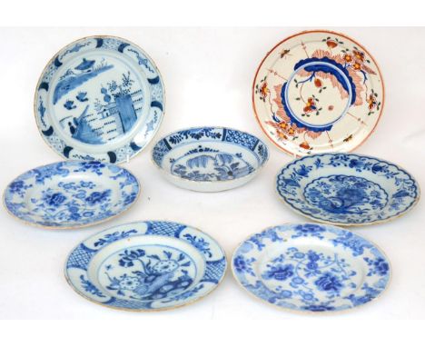 An English Delft saucer dish, circa 1750, painted in blue with a fenced garden within a panel border, 20cm diameter; a Delft 