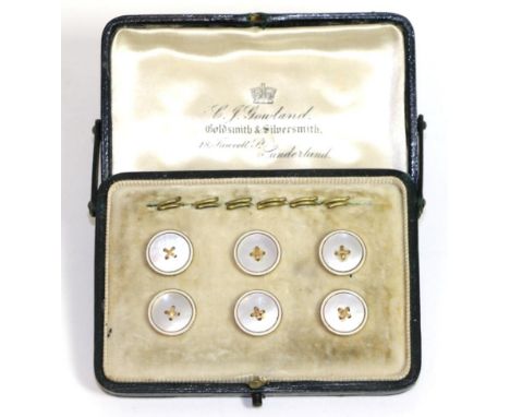 A set of six mother-of-pearl dress buttons, mother-of-pearl centres with button stitch detail and within white enamel borders