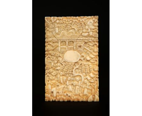 A CHINESE IVORY CARD CASE, 19TH CENTURY, Canton, densely carved with figures and buildings. 11cm by 7cm