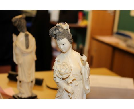 A SET OF THREE CHINESE IVORY FIGURES, early 20th Century, each carved as a maiden holding foliage and raised on a carved wood