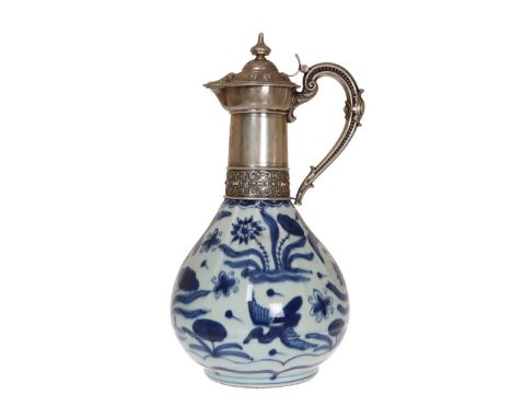 A 19th CENTURY CHINESE SILVER MOUNTED EWER, the neck engraved 1835 29 Mei 1885, the pear shaped blue and white porcelain body