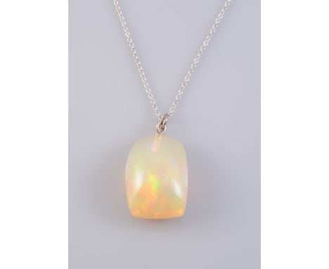 AN OPAL PENDANT, the large polished boulder opal suspending simply from a fine oval link chain with bolt ring clasp. Stamped 