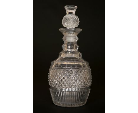 A LATE GEORGIAN CUT-GLASS DECANTER, with thistle stopper. 26.5cm