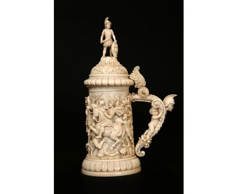 A LARGE EUROPEAN IVORY TANKARD, 19TH CENTURY, probably South German, carved in Renaissance style with a battle scene. 28cm