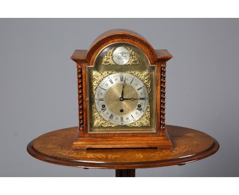 A 1920'S OAK CHIMING MANTEL CLOCK, with three-train movement and barley twist columns, 34.5cm high.