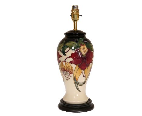 A MOORCROFT LAMP, "ANNA LILY", first quality, retains original price label of £605. 38cm to top of fitting