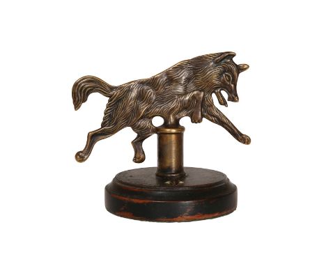 A WWII PERIOD GERMAN ARMY WERWOLF (WEREWOLF) BRASS BRIGADE BANNER, on a turned wood base. 11.5cm high