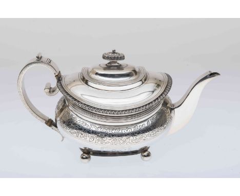 A GEORGE III SILVER TEAPOT, Naphtali Hart, London 1814, of rounded rectangular form, with gadrooned rim above a foliate engra