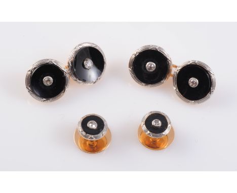 A BLACK ONYX AND DIAMOND CUFFLINK AND COLLAR STUD SET, each circular black onyx mount set to the centre with a single brillia