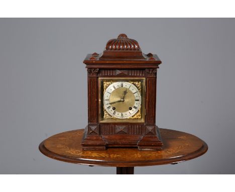 A WINTERHALDER & HOFMEIER ROSEWOOD CASED CHIMING MANTEL CLOCK, late 19th Century, the dial with Roman numerals, 37cm high.