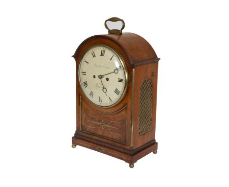 AN INTERESTING REGENCY MAHOGANY TABLE CLOCK, the cut brass inlaid case with arched top, brass carrying handle and brass grill