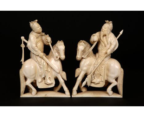 A PAIR OF CHINESE IVORY FIGURES, 19TH CENTURY, each mounted figure carved holding a weapon. 15.5cm high