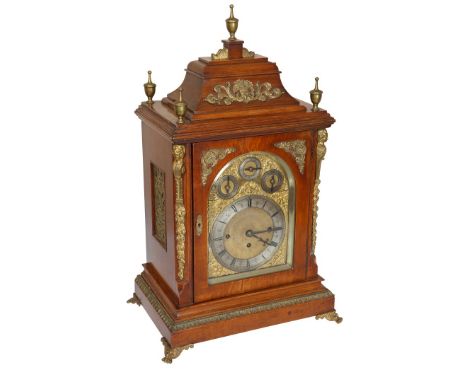 A LARGE VICTORIAN OAK CHIMING TRIPLE FUSEE BRACKET CLOCK, the vase with caddy top surmounted by brass urn finials, the case s