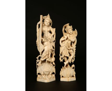 TWO INDIAN CARVED IVORY FIGURES, SARASVATI AND KRISHNA, LATE 19TH CENTURY. Tallest 26.5cm